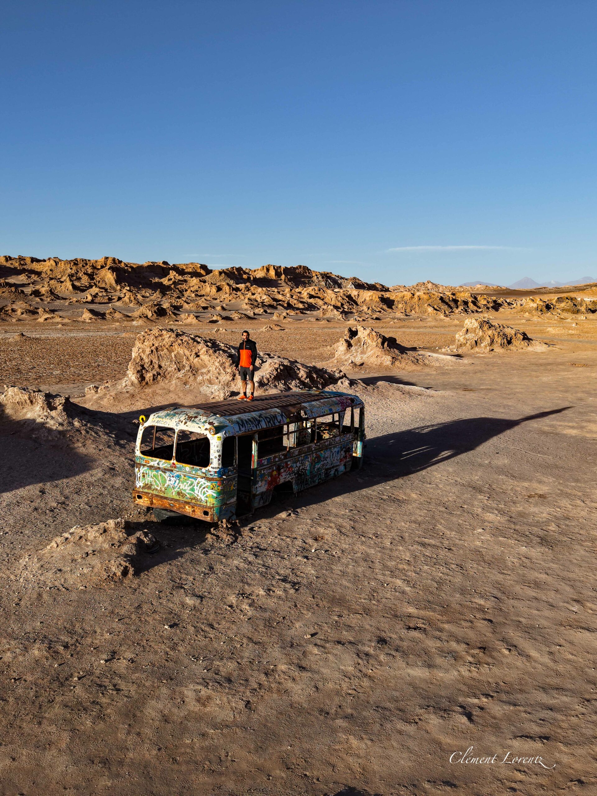 Magic Bus Vallecito Atacama Aerial view of the Magic Bus in Vallecito at Atacama Desert, showing the abandoned bus at sunset.