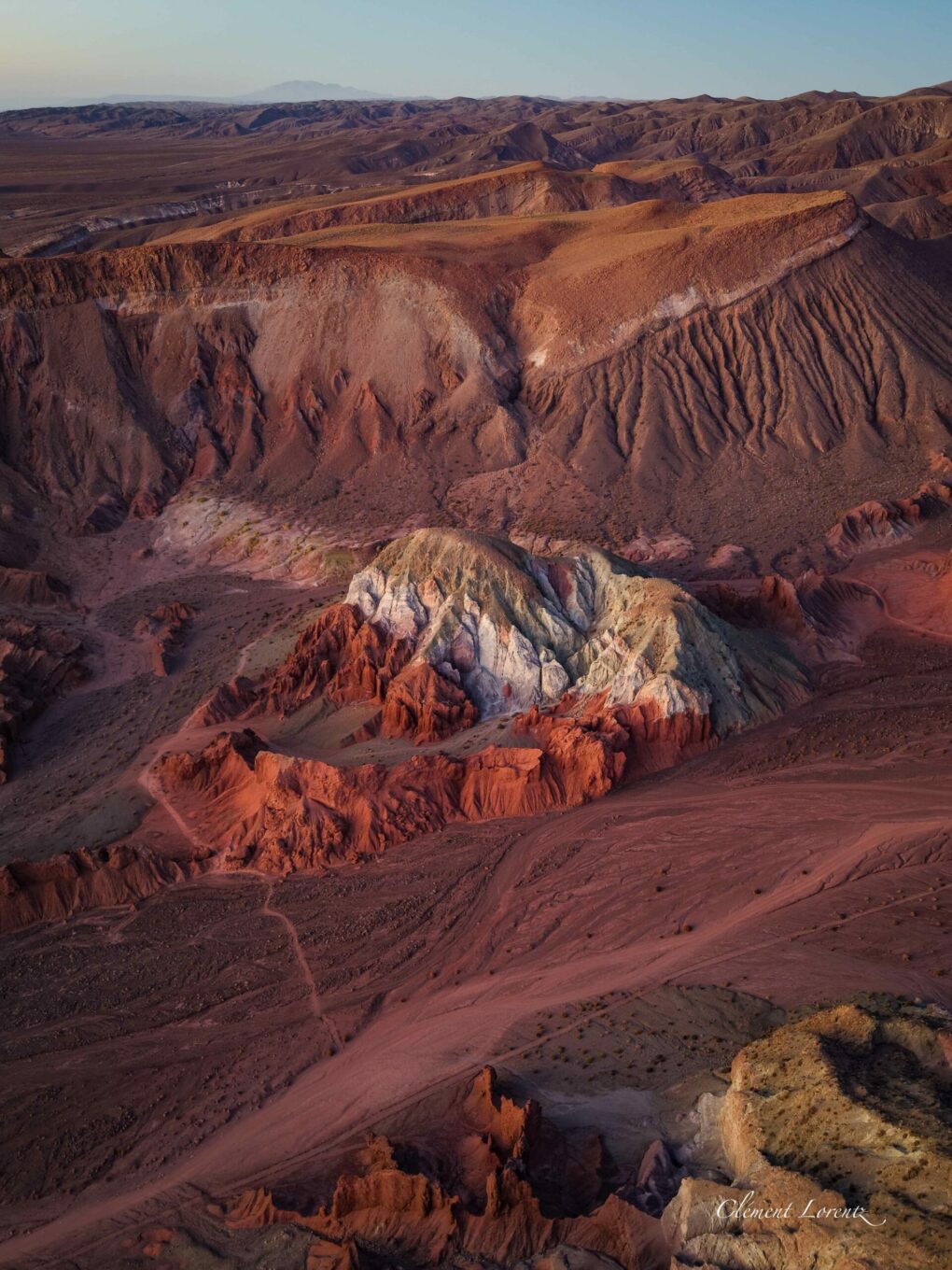 Valle del Arcoiris Atacama Desert Drone view of Rainbow Valley or Valle del Arcoiris, showing colored mountains at sunrise.