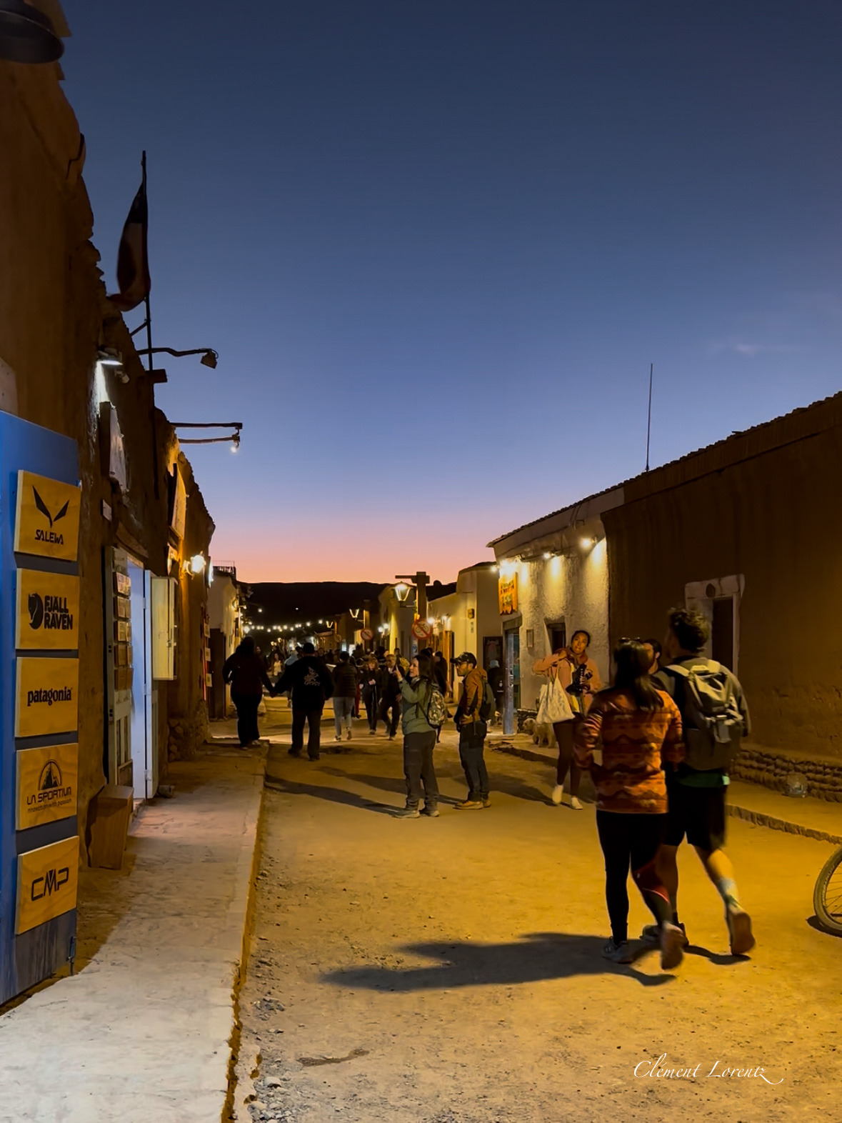 Caracoles San Pedro de Atacama Street view of Caracoles at dusk, with warm lights illuminating the charming mountain town.
