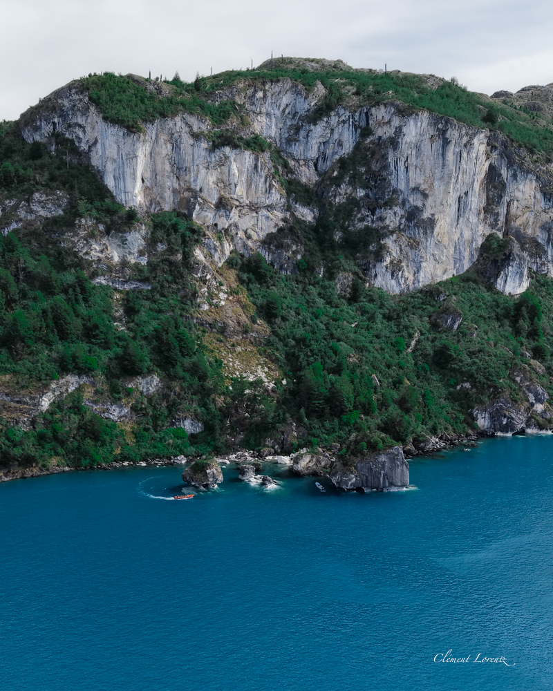 Capillas Marmol 4 Drone view of the Marble Caves on General Carrera Lake, with the marble mountain façade in the background, Patagonia, Chile
