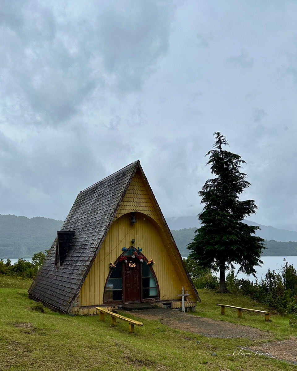 Eglise Patagonie Unique wooden church along the Carretera Austral in Patagonia, Chile, with a distinctive roof design that extends all the way to the ground.
