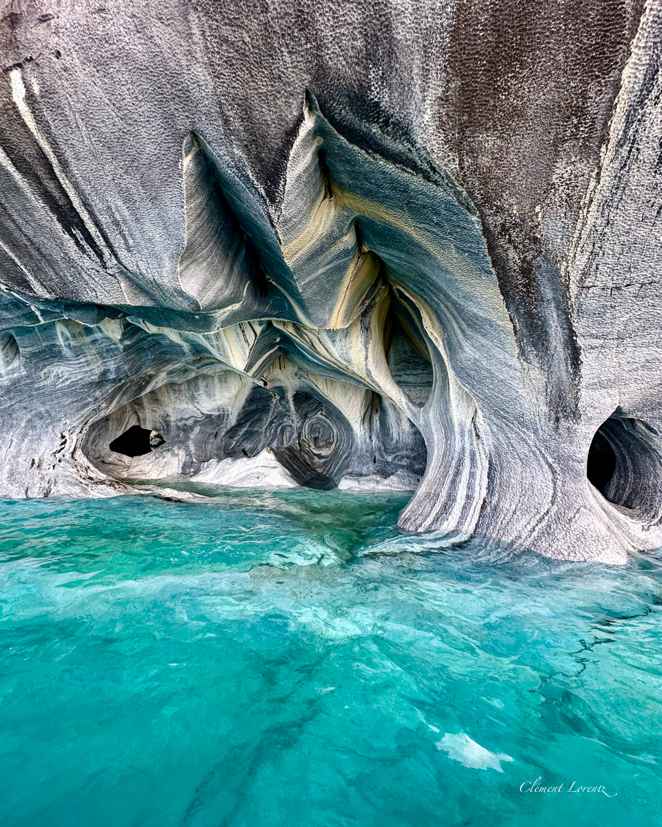 Capillas de Marmol Puerto Rio Tranquilo Close-up of the Marble Caves on General Carrera Lake, highlighting the vibrant blue colors, smooth marble walls, and crystal-clear water in Patagonia, Chile.