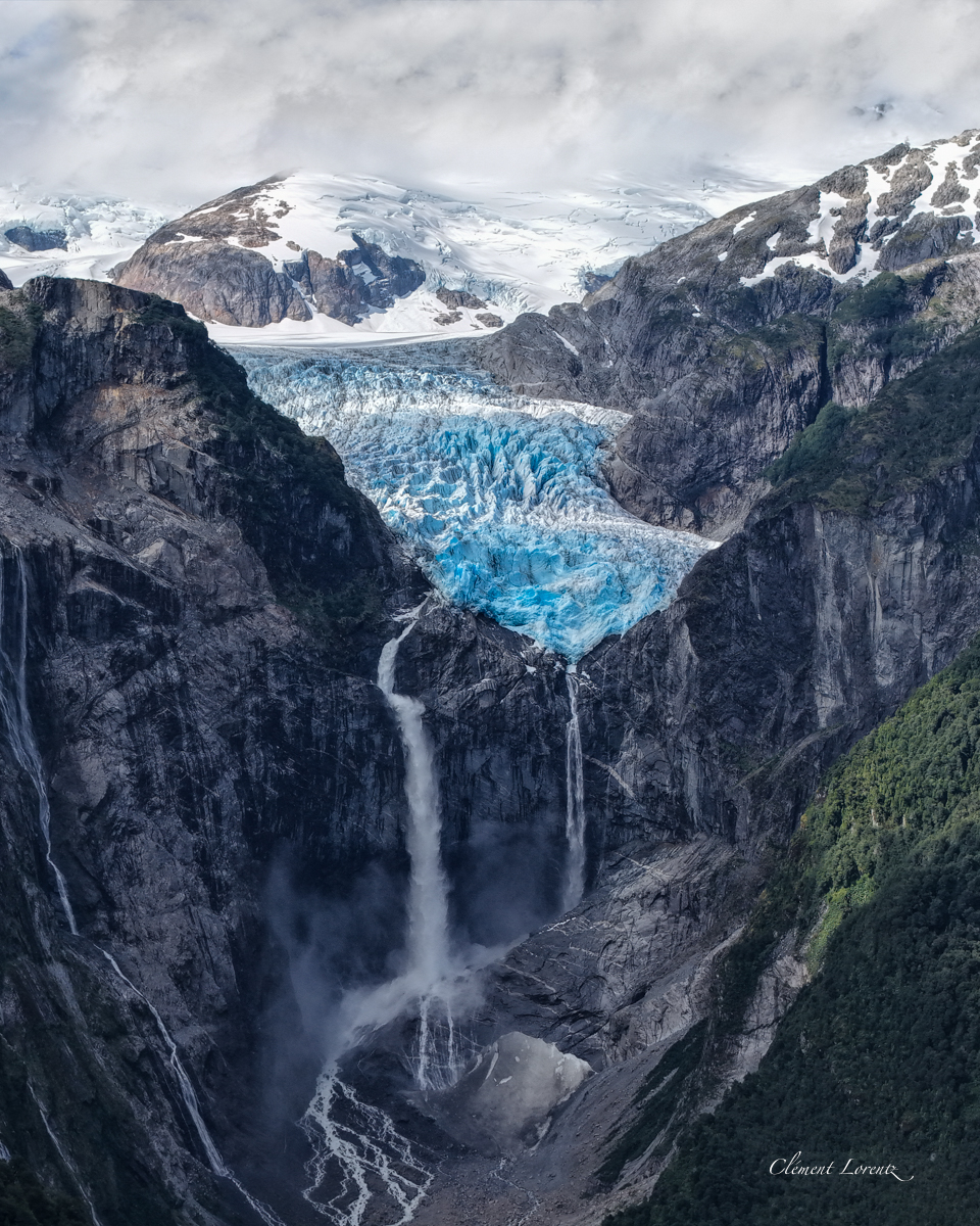 Parque Queulat View of Queulat Glacier and its cascading waterfall along the Carretera Austral in Patagonia, Chile, surrounded by lush green mountains.