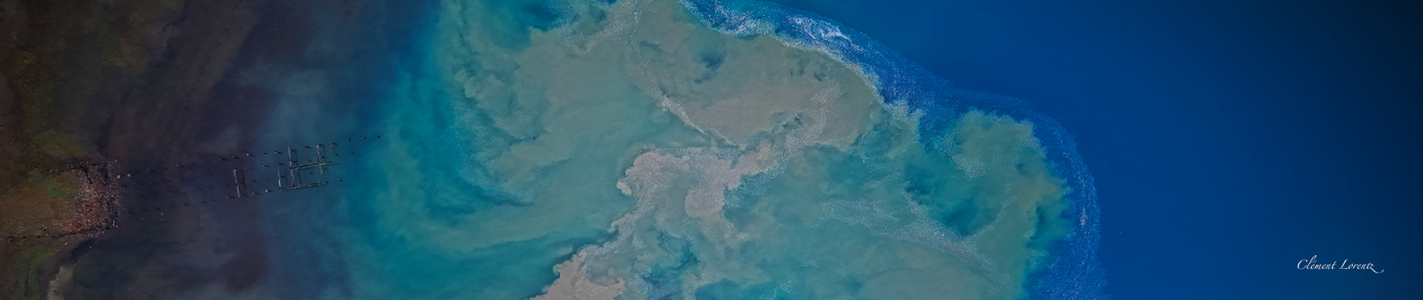 TopDown General Carrera Bird eye view of muddy river water after the rain mixing into General Carrera Lake along the Carretera Austral in Patagonia, Chile
