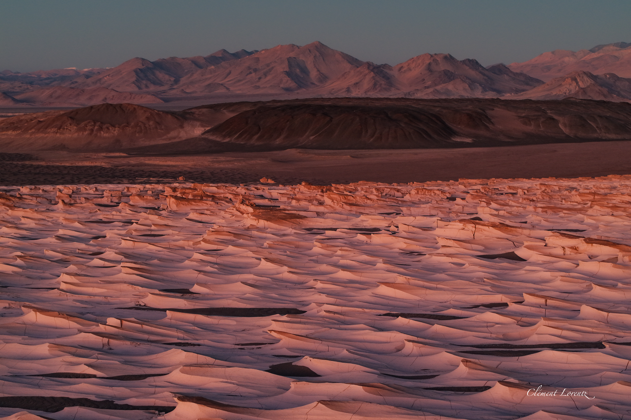 Wide view of Campo de Piedra Pomez at dusk with its surreal shapes and remote desert atmosphere.