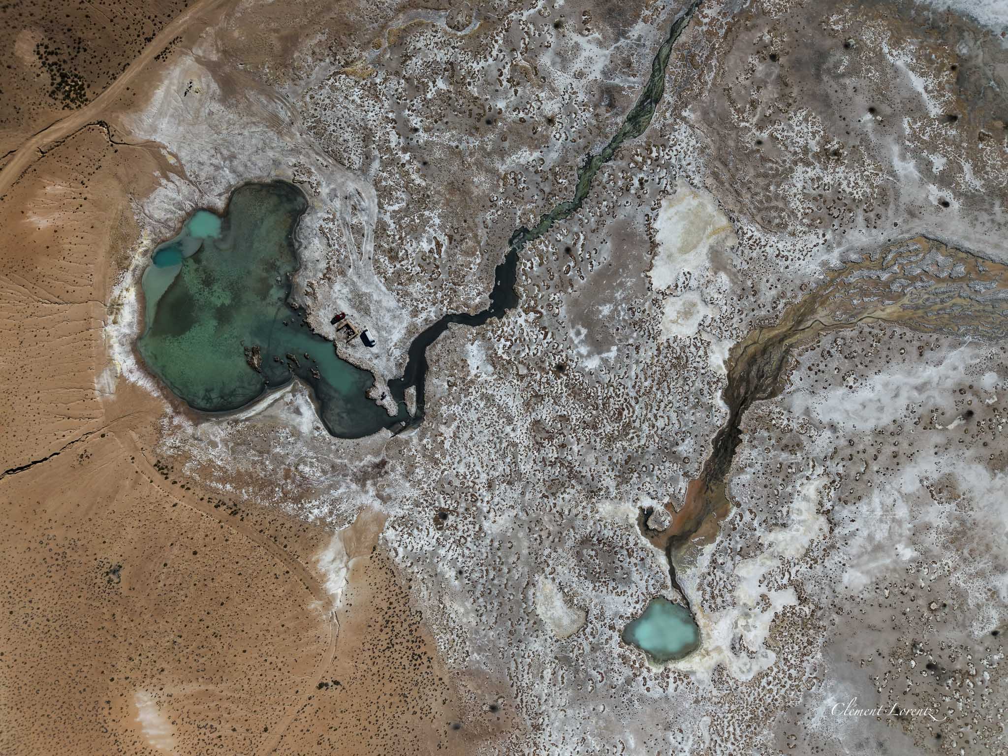 Drone topdown view of the hot spring pool at Polloquere