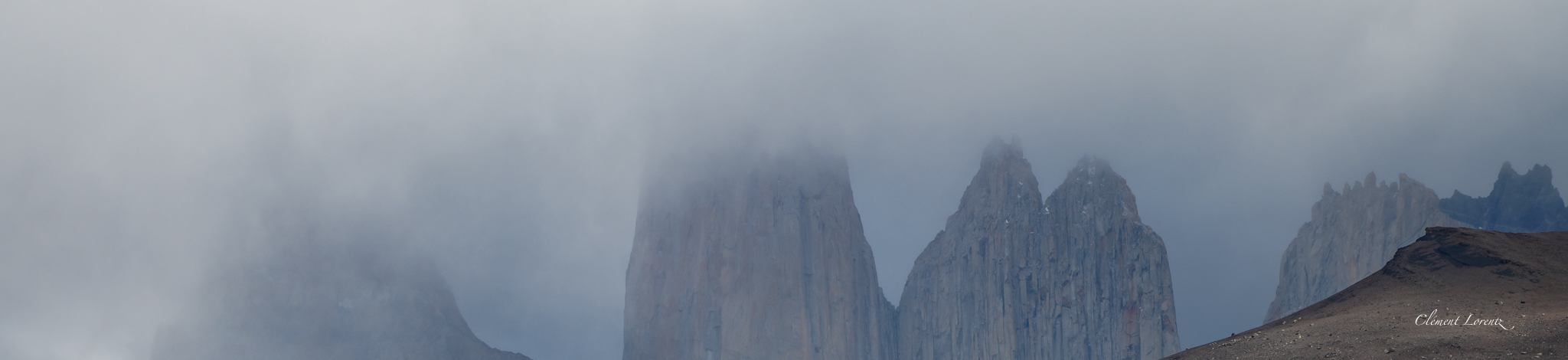 Las Torres granite towers beneath dramatic clouds in Patagonia